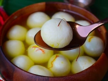 Top South Indian Rasgulla Sweet Shop Chennai A bowl of Rasgullas, an Indian dessert made of soft, spongy cheese balls soaked in sugar syrup.