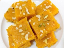 Best South Indian Mango Barfi Sweet Dealers in Chennai Mango-barfi squares, arranged attractively on a plate and display their delightful presentation.
