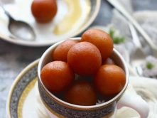 Best South Indian Paneer Jamun Sweet Suppliers in Chennai A bowl of colorful and appetizing paneer-jamun balls on it, showcasing a delightful dessert.